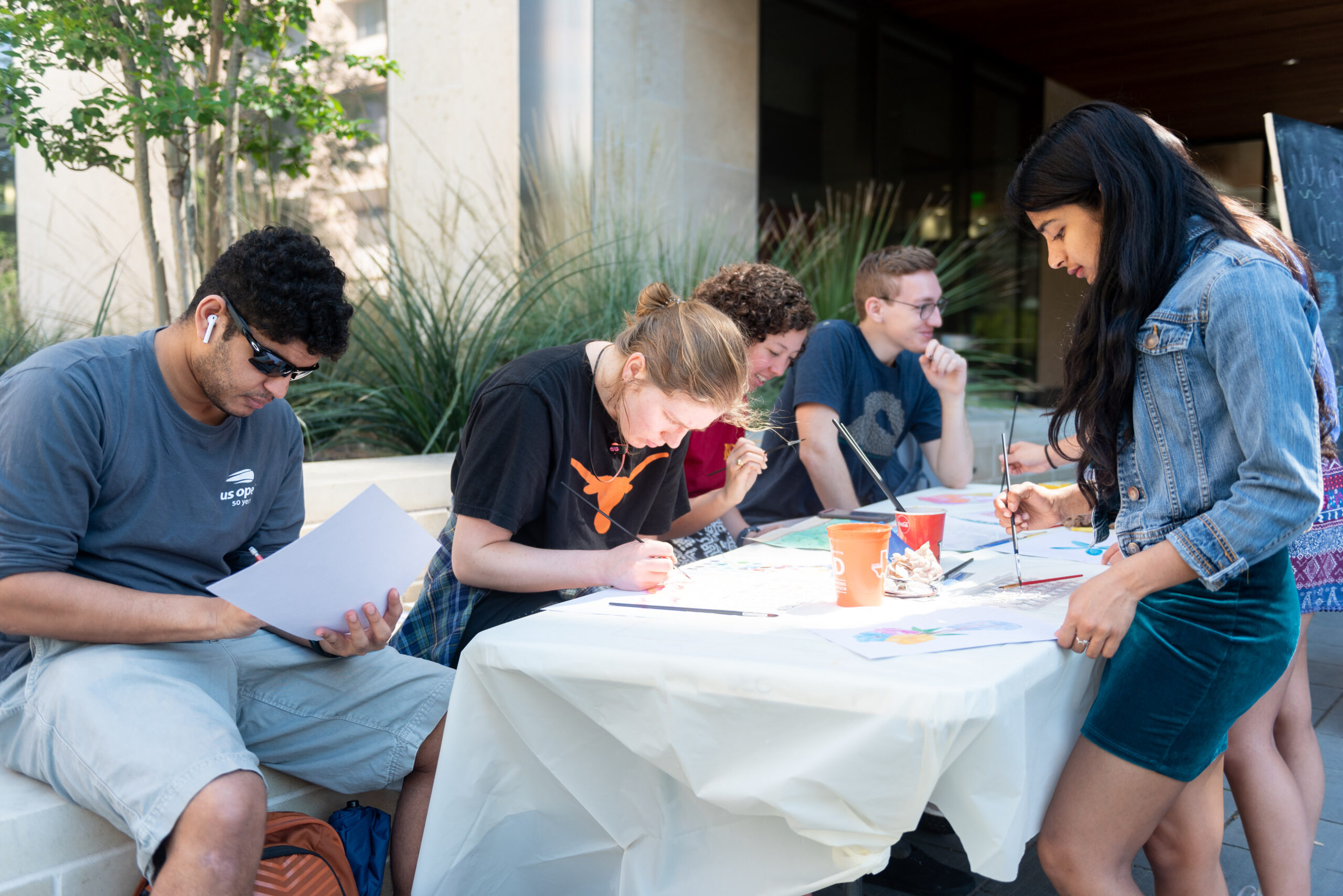 students doing watercolor for Cockrell School Cares week