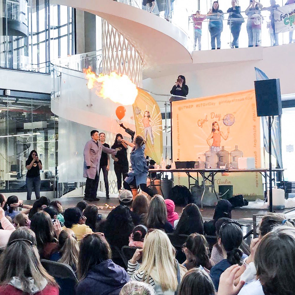 Girl Day demonstration of balloon exploding with fire